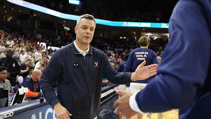 Tony Bennett greets his players before the Virginia men's basketball game against Houston at John Paul Jones Arena.
